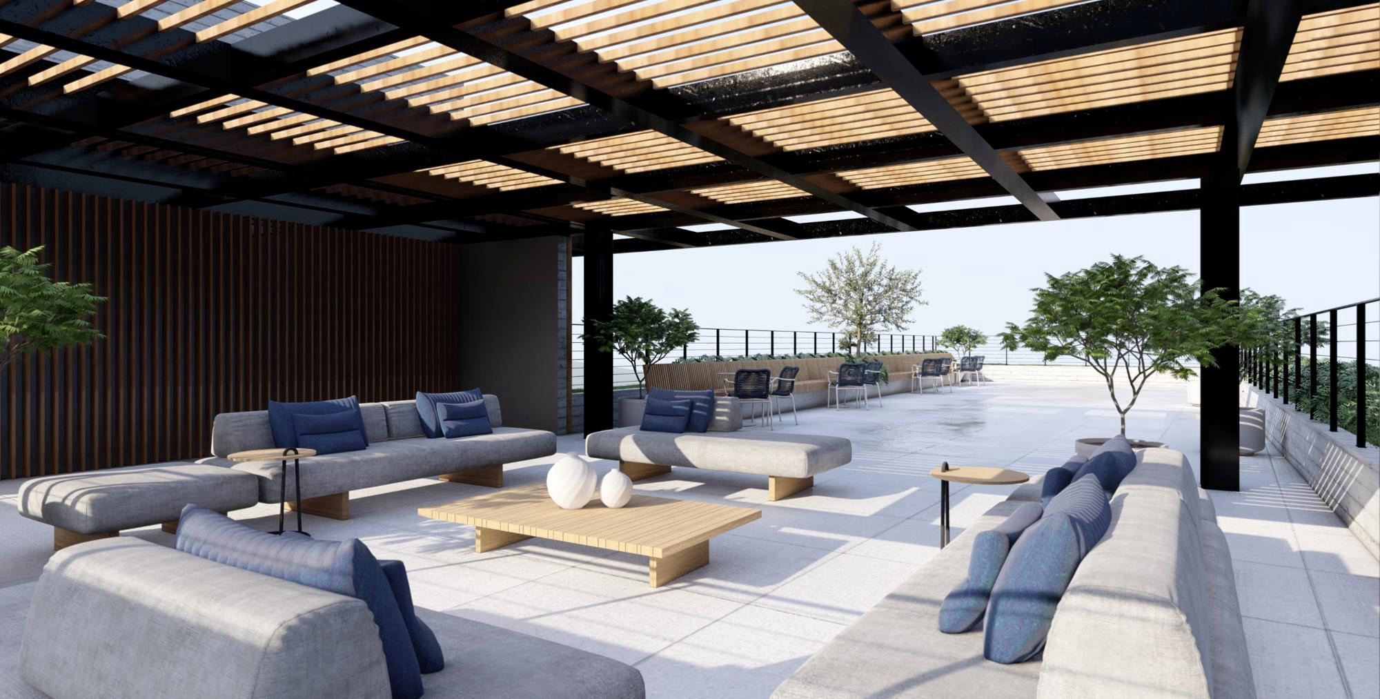 Rooftop com sofás, pérgola e vista aberta